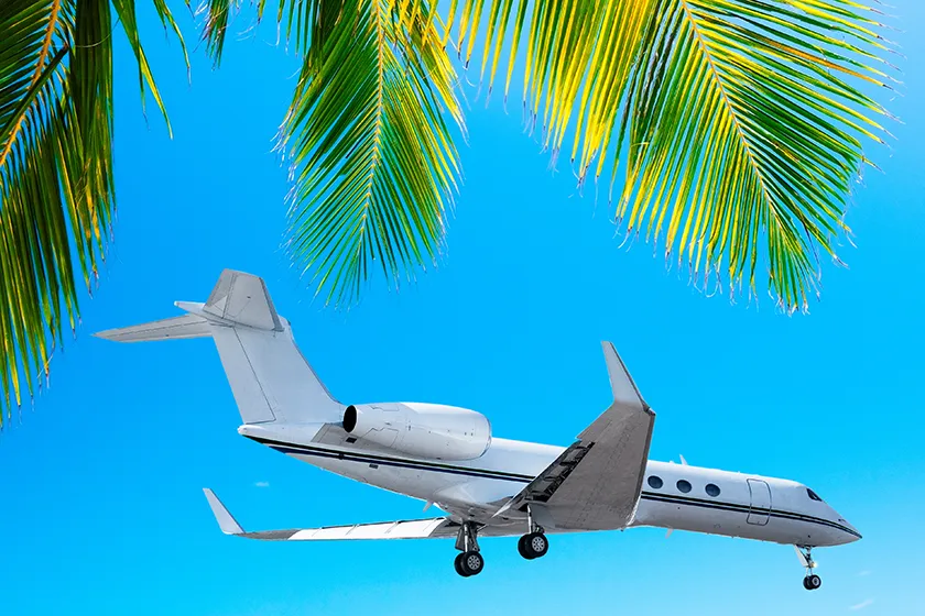 Private jet landing in paradise